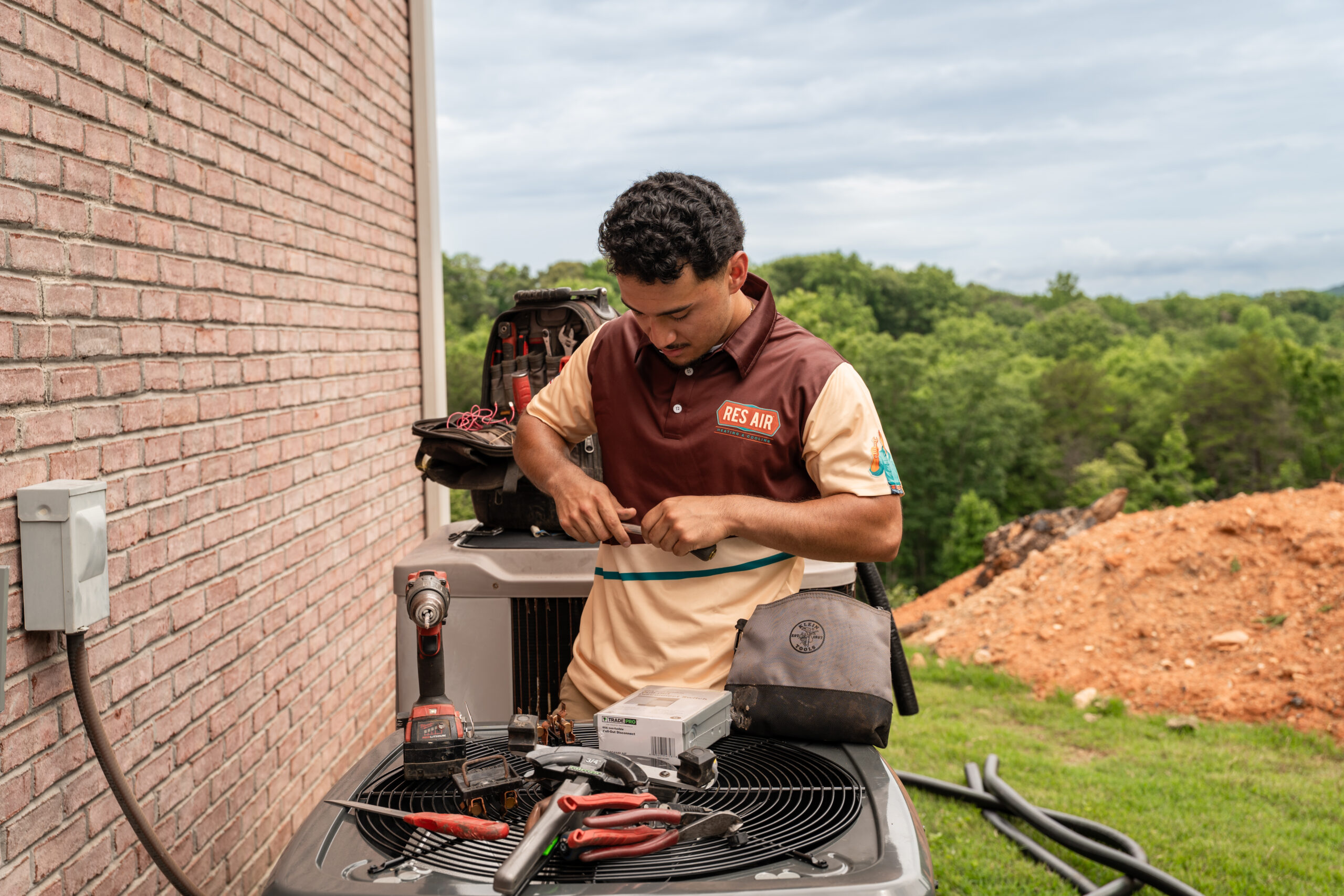HVAC technician diagnosing sudden air conditioning failures in a residential cooling system